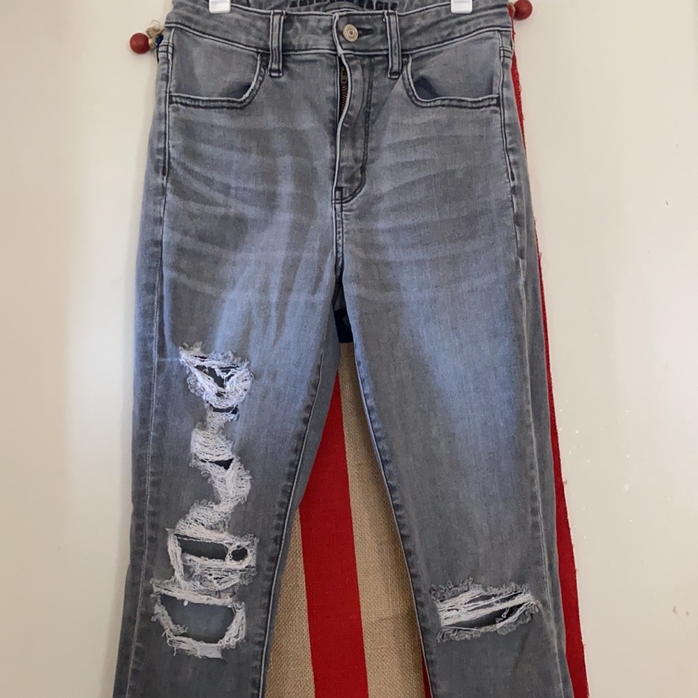 Grey skinny jeans with white distress